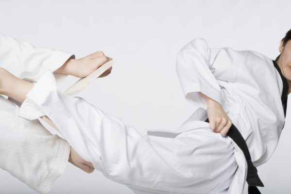 Close-up of a woman practicing kickboxing